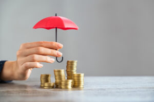 guarda-chuva protegendo investimentos na matéria bolsa com proteção