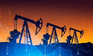 montagem com gráficos de mercado financeiro sobrepostos a imagem de bombas de extração de petróleo